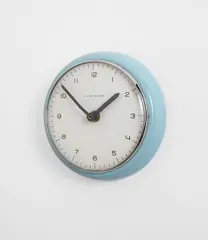 Max Bill, Wall clock, circa 1957, Glazed porcelain, glass, chromium-plated metal, enameled metal, brass