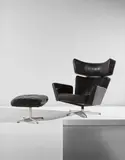 Arne Jacobsen, "Ox" armchair and ottoman, 1971, Leather, chromium-plated metal, painted steel