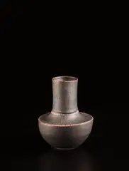 Small vase by Lucie Rie, circa 1960, Porcelain, manganese glaze with sgraffito design on the shoulder, sold Dec 2016