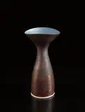 Vase with flaring lip by Lucie Rie, circa 1960, Porcelain, manganese glaze, cobalt blue interior with sgraffito design, sold Dec 2016
