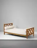 Jean Royere, "Croisillon" bed, circa 1955, Oak-veneered wood, fabric