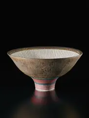 Unique footed bowl by Lucie Rie, circa 1978, Porcelain, golden manganese glaze with sgraffito , the interior unglazed with inlaid radiating design. Turquoise green r, sold Dec 2016