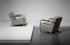 Robert Mallet-Stevens, Pair of armchairs from the apartment building at 7, rue Méchain, Paris, circa 1929, Chromium-plated steel, painted wood, fabric