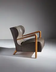 Jean Royere, Rare wingback armchair, circa 1947, Oak, coated canvas