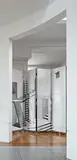 "Scaletta" four-panel screen by Piero Fornasetti, designed 1955, Lithographic transfer-printed wood, painted wood, brass hinges, casters, sold Dec 2016