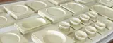 Jean Luce, 126-piece "Rectangulaire" dinner service, designed circa 1933, Glazed ceramic, glazed porcelain
