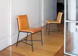 Jacques Adnet, Pair of side chairs, 1950s, Painted steel, leather