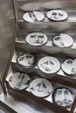 Set of ten plates, from the Tema e Variazioni series by Piero Fornasetti, 1950s-1960s, Transfer-printed glazed ceramic, sold Dec 2016