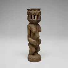 Dogon, Female figure with eleven heads, carved wood with ritual encrustation