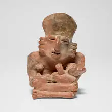Jalisco, Seated figure, red earthenware