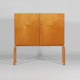 Model '250' cabinet by Alvar Aalto, birch plywood with two front doors, sold Jan 2026