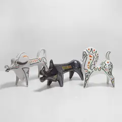 Roberto Rigon, Buffalo, a horse and a rhinoceros, the buffalo in a 'smalto sasso' glaze and detailed in purple