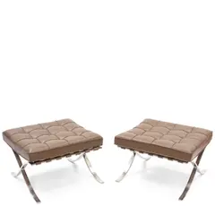 Pair of Barcelona Ottomans by Ludwig Mies van der Rohe, for Knoll, chromed steel, leather, with Knoll tag on underside, sold Oct 2025