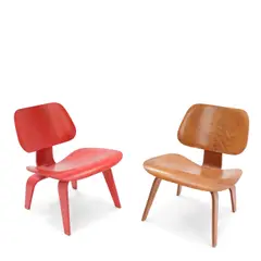 Red Analine LCW Chair and LCW Chair by Charles Eames and Ray Eames, for Evans Products/Herman Miller, molded plywood, rubber, the red chair with an Eames/Herman Miller black tag, sold Oct 2025