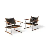 Jens Quistgaard, Pair of 'Stokke' Lounge Chairs, manufactured by Nissen, Langå, chromed steel, rosewood, leather