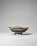 Lucie Rie, Knitted Footed Bowl, stoneware, inlaid in manganese beneath a pale green glaze, impressed with artist's monogram