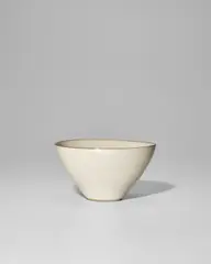 Conical Bowl by Lucie Rie, stoneware, white glaze with a manganese rim, impressed with artist's monogram, sold Jun 2025
