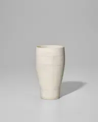 Beaker Vase by Lucie Rie, porcelain, matte white glaze with concentric circles in pale purple, impressed with artist's monogram, offered Jun 2025