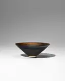 Lucie Rie, Small Conical Bowl, porcelain decorated with golden manganese bands, with sgraffito design radiating from the center, impressed with artist's monogram