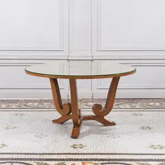 Guéridon circulaire by Jules Leleu, A signed and numbered circular coffee table in oak and mirrored glass by Jules Leleu circa 1942-1946, sold Oct 2025