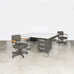 Un double bureau et une paire de fauteuils pivotants Direction by Jean Prouvé, sold Oct 2025