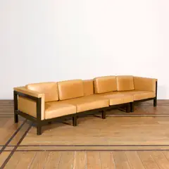 Jules Wabbes, Canapé quatre places 800, A four-seat '800' sofa in lacquered oak and leather designed by Jules Wabbes circa 1965 and edited by Mobilier Universel