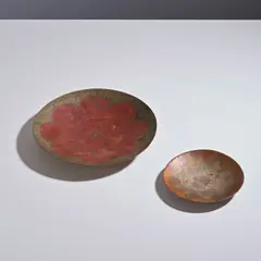 Claudius Linossier, Deux coupes, Two signed coupes in hammered patinated copper, partially silvered, by Claudius Linossier circa 1925