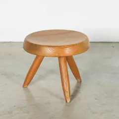 Charlotte Perriand, Tabouret bas tripode Berger, A 'Berger' tripode low stool in brushed pine designed by Charlotte Perriand in 1953
