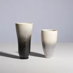 Jean Girel, Deux vases, Two signed vases in glazed porcelain by Jean Girel