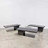 Patrick Hourcade, Suite de trois tables basses, A set of three coffee tables in stone, slate and lacquered metal by Patrick Hourcade