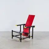 Gerrit Rietveld, Red Blue Chair, A branded 'Red Blue Chair' in lacquered wood and plywood designed by Gerrit Thomas Rietveld in 1918 and executed by Gerard A