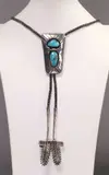 Carl Luthey, pictorial stick figure mark comprised of initials CWL (Carl W. Luthey, Native American silver (content unknown) and turquoise bolo tie
