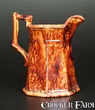 Molded Octagonal JOHN BELL / WAYNESBORO Redware Pitcher with Sponged Manganese Decoration by John Bell, circa 1860, Redware, sold Nov 2013