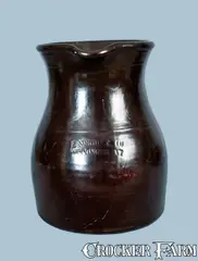 E. Norton & Co., E. NORTON & CO. / BENNINGTON, VT.Albany-Slip Stoneware Pitcher, late 19th century, Stoneware