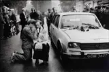 Jean Gaumy, Lech Wałęsa receiving benediction from a Catholic priest, Gdansk, Poland 1980, 1980, Gelatin silver print, printed in 1989 on double-weight semi-matte paper