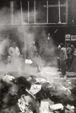 Erich Lessing, Insurgent recites Petöfi while propaganda is burned, Budapest 1956, 1956, Vintage silver print on double-weight semi-matte Agfa paper, in very good condition. Photographer's "Magnum" copyright stamp, handwritten negative no. "56-9-15/16-17" in ink and "56-9-15/11A" in penci
