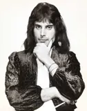 Harry Goodwin, Freddy Mercury, 1970, Vintage silver print on single-weight ferrotyped paper, in very good condition. Photographer's stamp and annotated "Freddy Mercury (Queen)" in blue felt-tip pen on the reverse. Deutsch: Vintage-Silber
