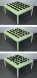 Rafael Lozano-Hemmer, Synaptic Caguamas, 2004, glass bottles on motorized wooden table, computer and custom software