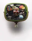 Self-Portrait by Nam June Paik, 1989, 1950's Philco Predicta television cabinet containing bronze mask of the artist, video tape, antique TV cubes and circuit, sold Apr 2015