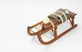 Joseph Beuys, Sled, 1969, Wooden sled, felt, belts, flashlight, fat, rope, and oil paint (brown cross)