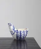 Hen sujet (Hen Subject) by Pablo Picasso, 1954, White earthenware turned shaped piece painted in blue,, sold Oct 2015