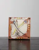 Visage stylisé en Y (Y-Stylized Face) by Pablo Picasso, 1968-69, Red earthenware square plaque painted in colors with partial brushed glaze,, sold Oct 2015