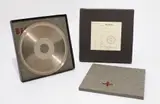 Joseph Beuys, Sun Disc, 1973, Record matrix (nickel-plated copper) with die-cut hole, felt pads stamped with brown paint, in box,