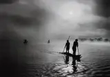Fishing in the Piulaga Laguna during the Kuarup ceremony of the Waura Group, Upper Xingu Basin, Mato Grosso, Brazil by Sebastião Salgado, 2005, Gelatin silver print, sold Apr 2015