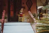 William Eggleston, Untitled (Santa Claus figure on porch)