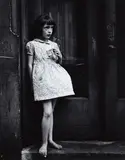 Yasuhiro Ishimoto, Young Girl, Barefoot, Holding Package of Candy Cigarettes, 1948-1952, Gelatin silver print, printed no later than 1962