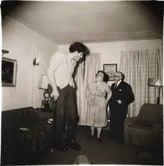 Diane Arbus, A Jewish giant at home with his parents in the Bronx, N.Y., 1970, Gelatin silver print, from the portfolio A Box of Ten Photographs , printed by Neil Selkirk