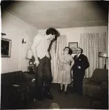 A Jewish giant at home with his parents in the Bronx, N.Y. by Diane Arbus, 1970, Gelatin silver print, from the portfolio A Box of Ten Photographs , printed by Neil Selkirk, sold Oct 2015