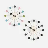 Ball wall clocks model 4755, set of two by George Nelson & Associates, 1949, lacquered wood, lacquered metal, gilt steel, sold Feb 2026