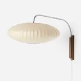 Bubble wall lamp by George Nelson & Associates, 1952, sprayed fiberglass over metal frame, matte-chromed steel, walnut, enameled steel, sold Feb 2026